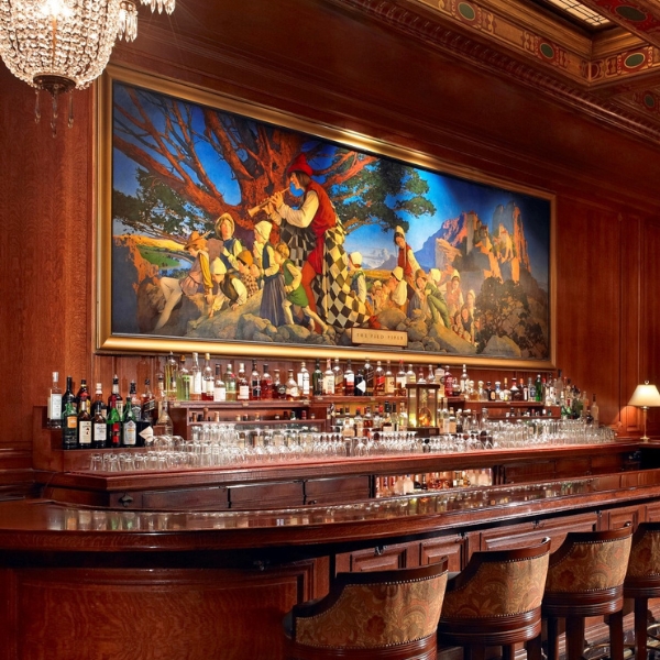 a bar with a painting on the wall