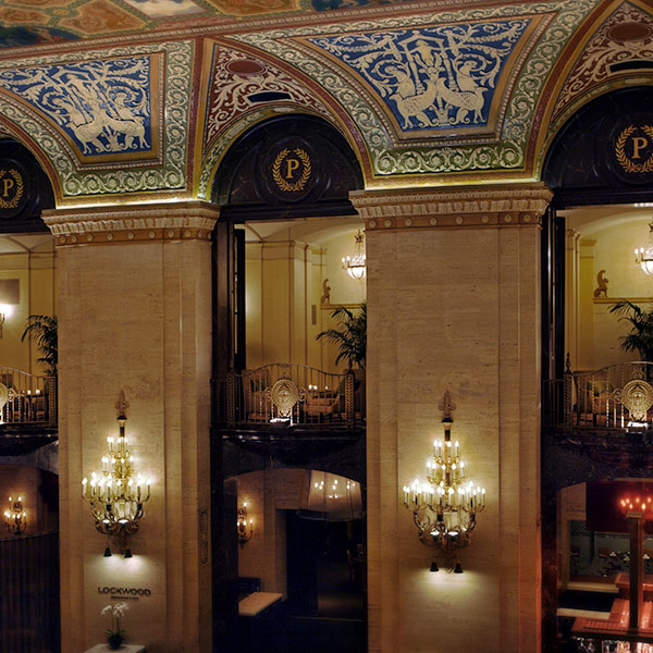 a building with ornate walls and chandeliers