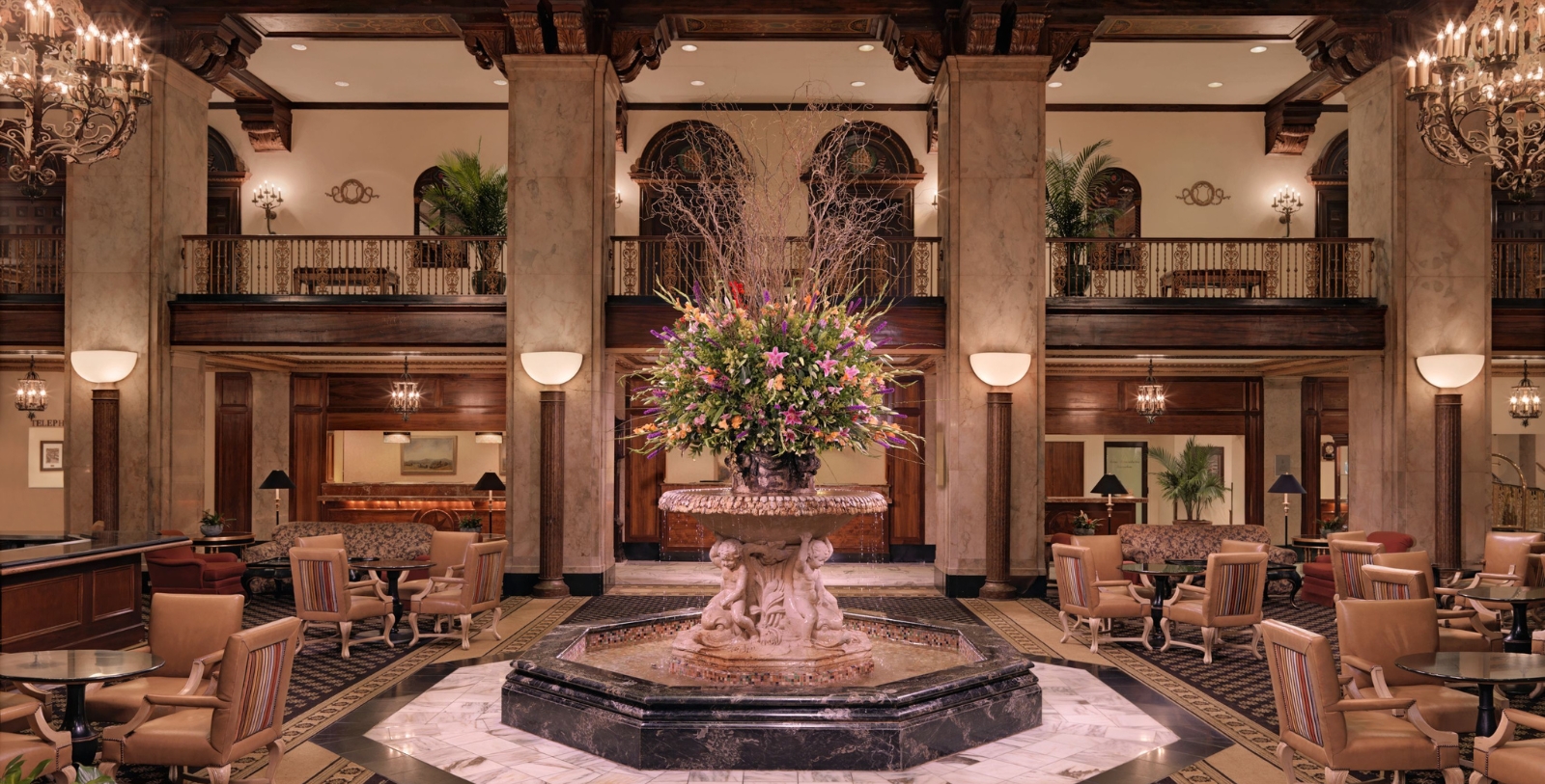 a large fountain with flowers in it