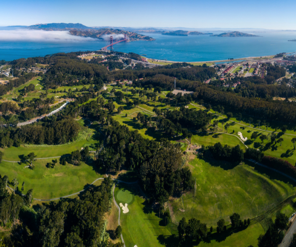 aerial view of a golf course and a body of water