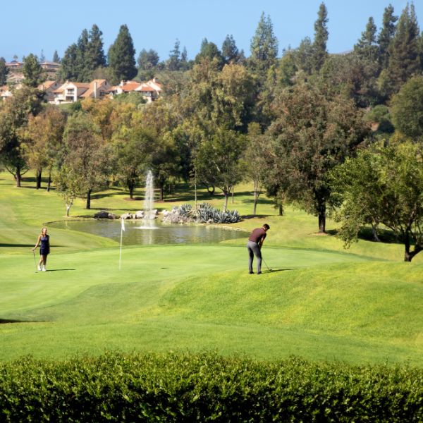 a man and woman playing golf