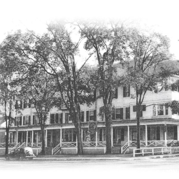 a large white building with trees