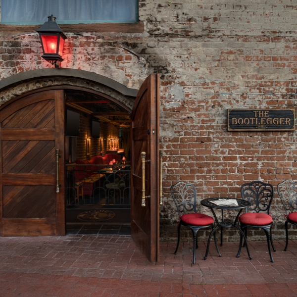 a brick building with a table and chairs