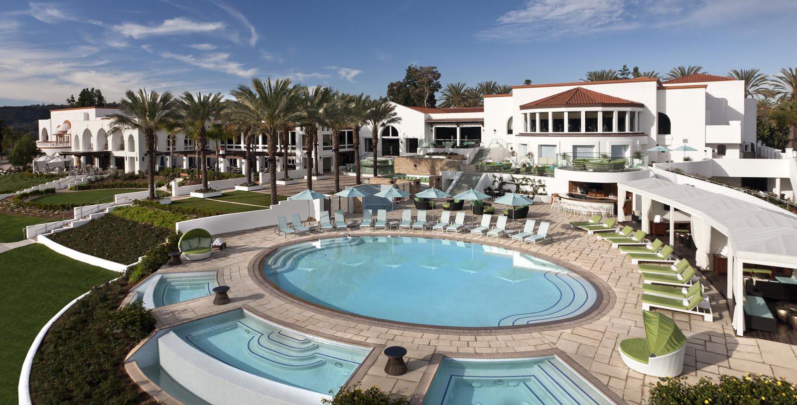 a pool with lounge chairs and palm trees 4