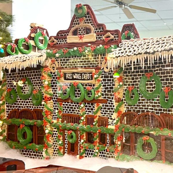 a gingerbread house with a fan