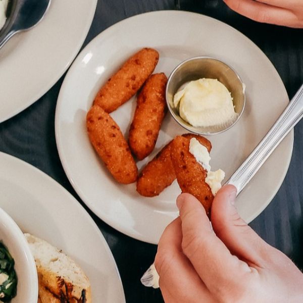 a person eating food on a plate