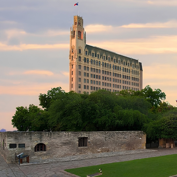 a building with a flag on top of a tower