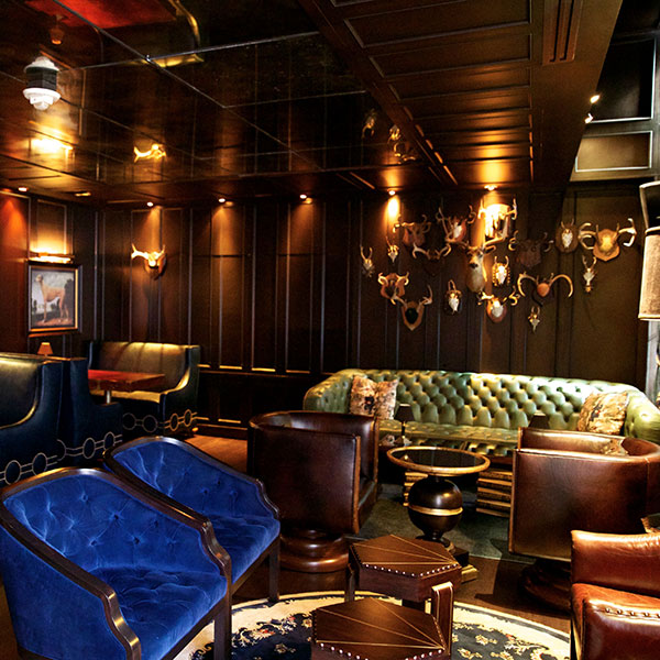 a room with a couch and chairs