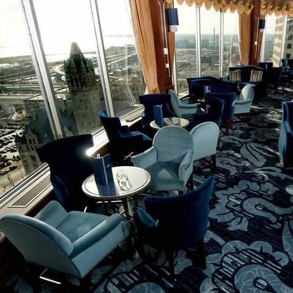 a room with blue chairs and tables