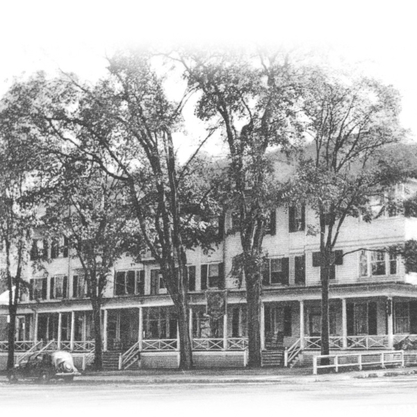 a large white building with trees