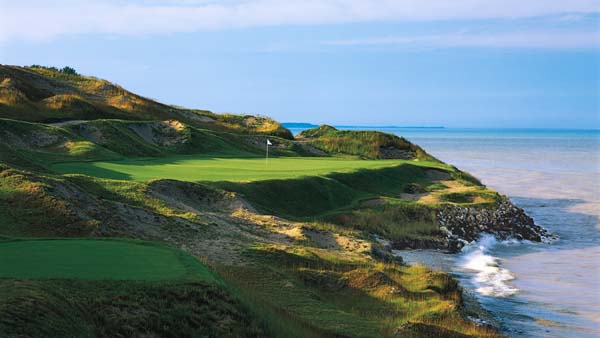 a golf course with a flag on the green