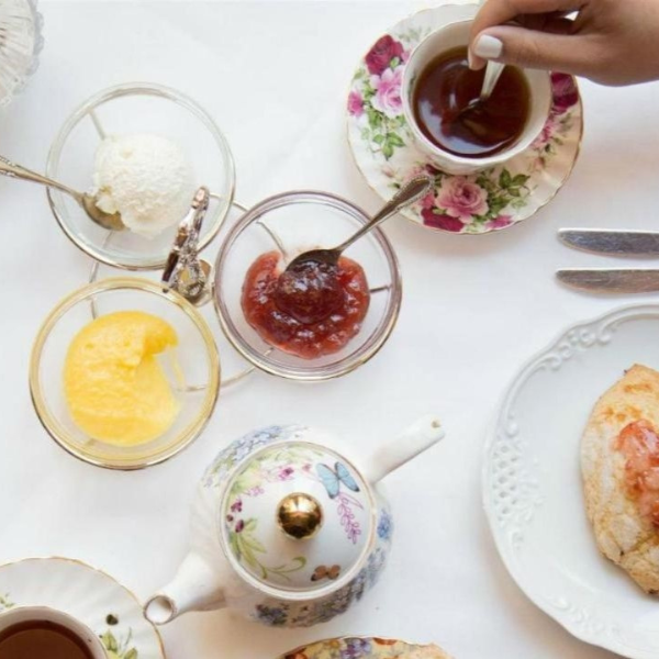 a table with tea and desserts