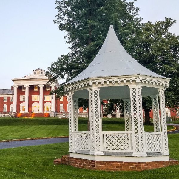 a white gazebo in a park