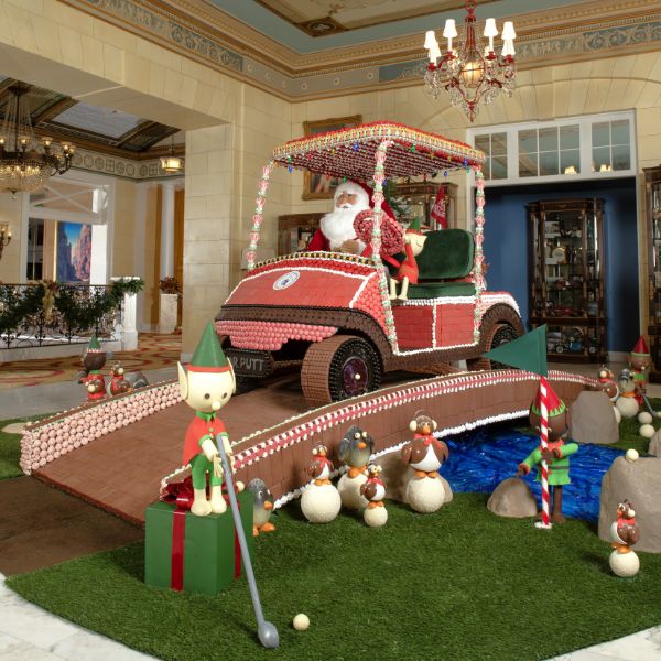 a santa in a golf cart