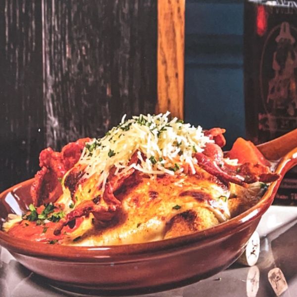 a bowl of food with a wooden spoon