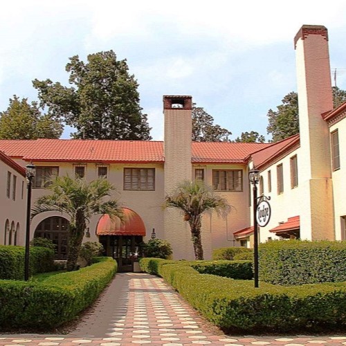 a building with a red roof and a red roof