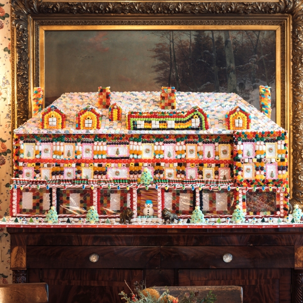 a gingerbread house on a dresser