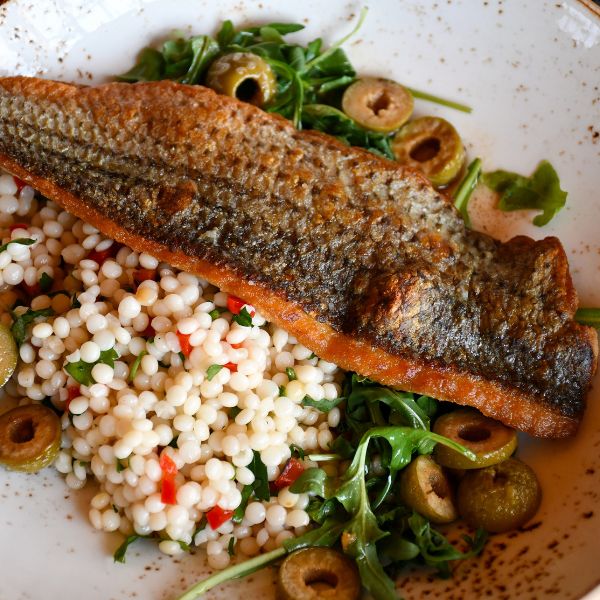 a fish and salad on a plate