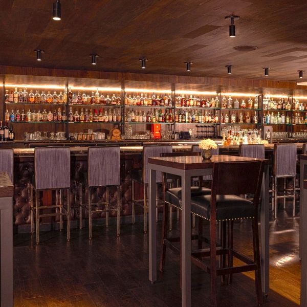 a bar with bottles on shelves