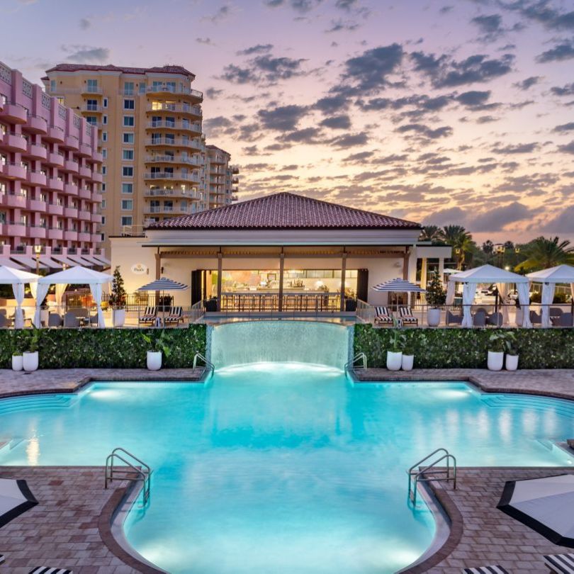 a pool with a building in the background