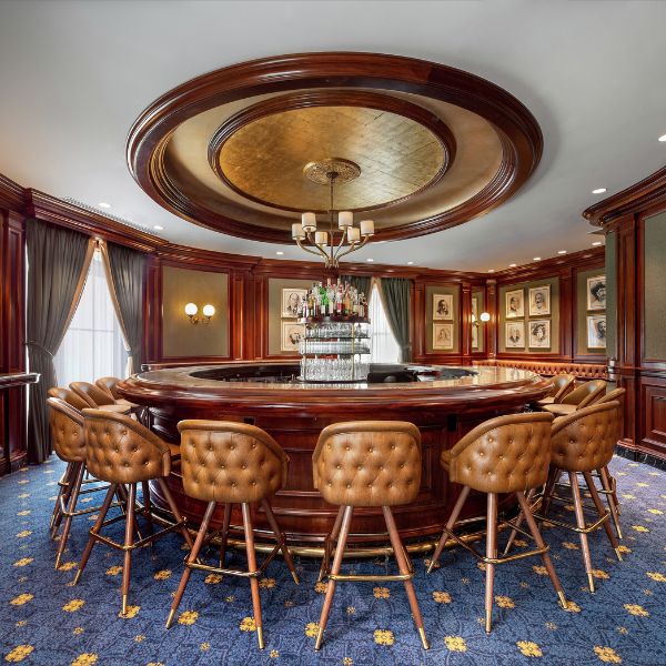 a room with a round table and chairs