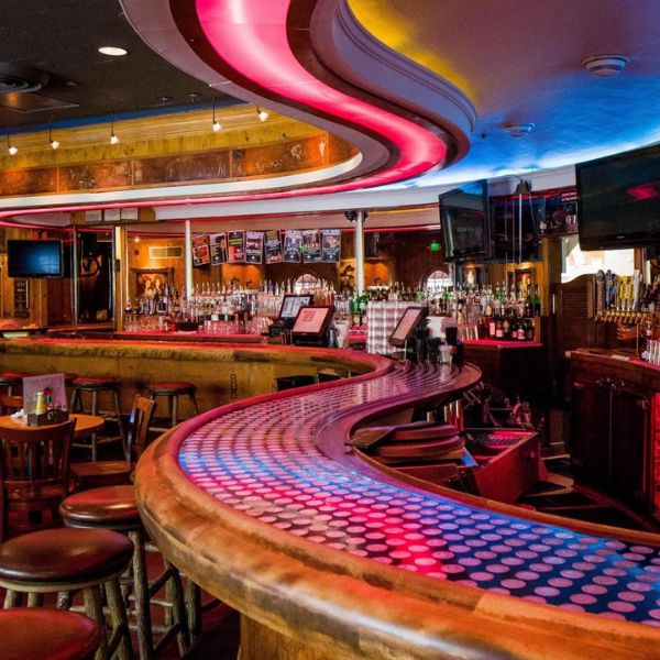 a bar with a counter and bar stools