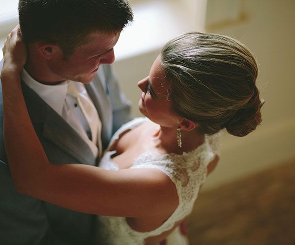 a man and woman in a white dress