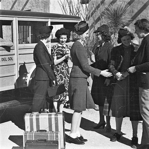 a group of people standing outside a truck