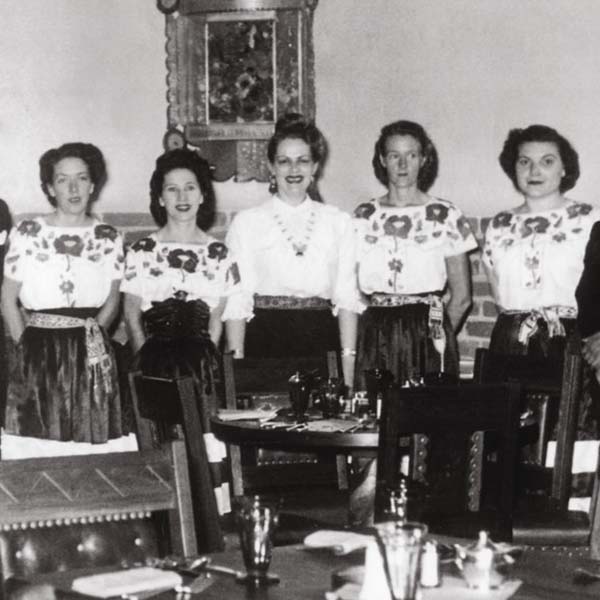 a group of women standing in a room
