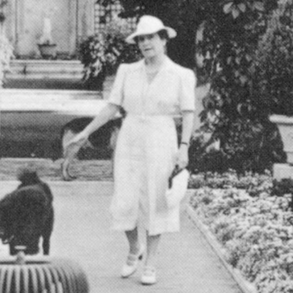 a woman walking with a cat