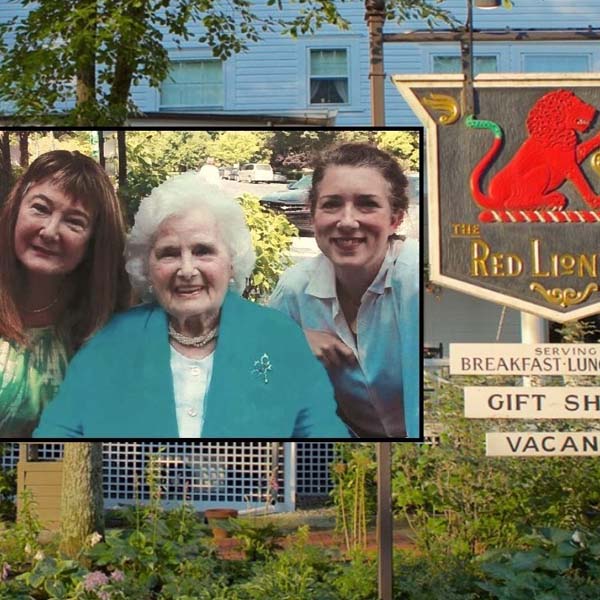 a sign with a group of women