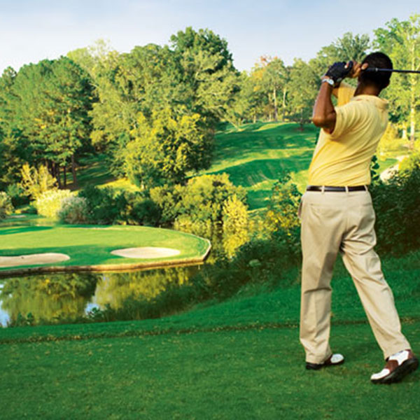 a man swinging a golf club