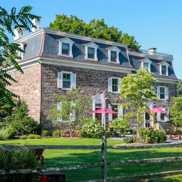 a house with a fence and trees
