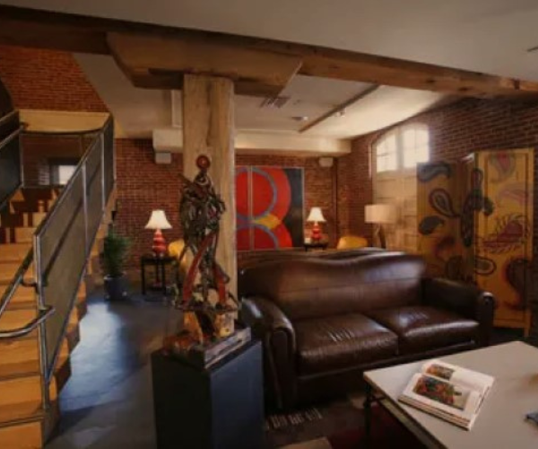 a room with a couch and a staircase