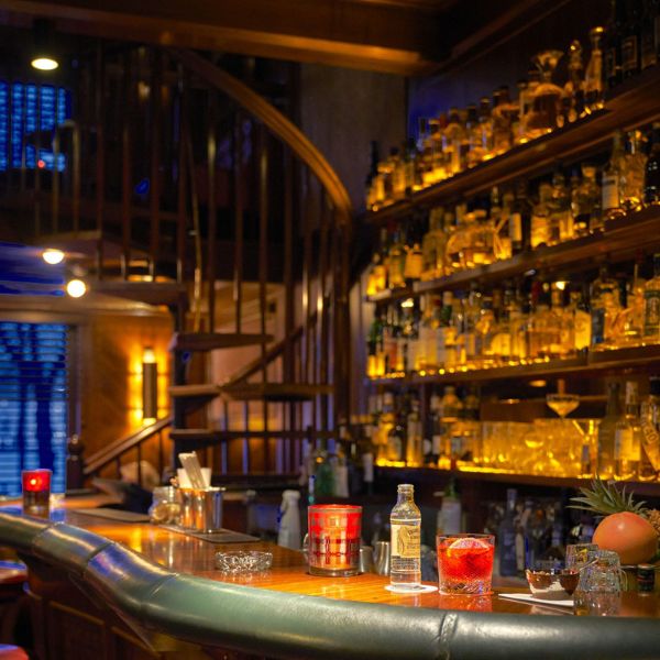 a bar with bottles on the counter