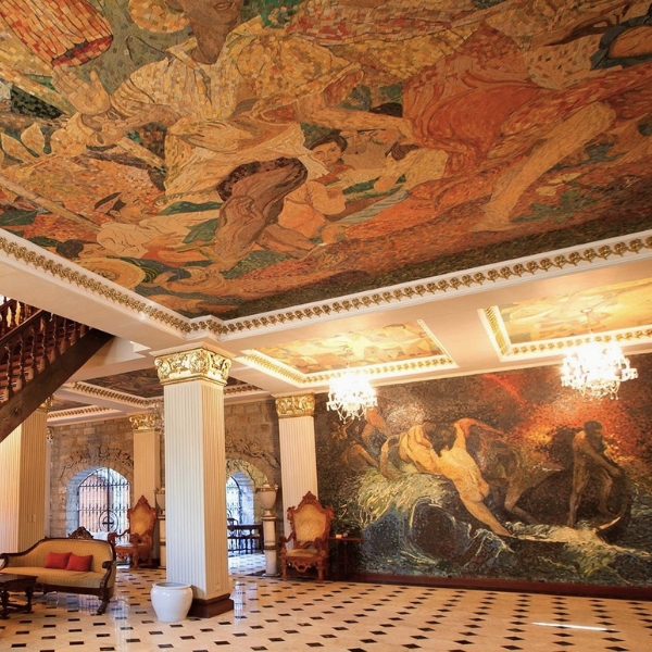 a large room with a mosaic ceiling