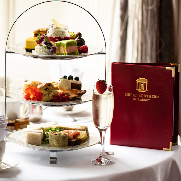 a three tiered tray of food on a table