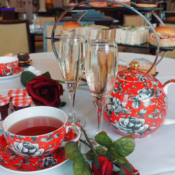 a table with tea cups and glasses