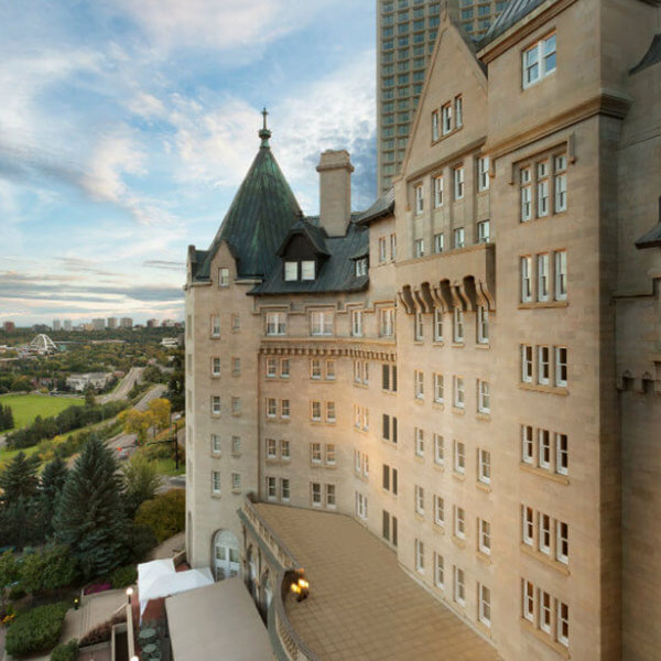 a large building with a city in the background