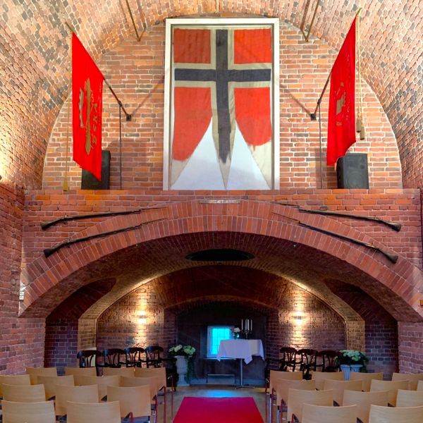 a room with chairs and flags
