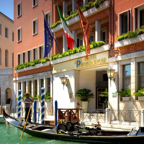 a gondola on the water next to a building