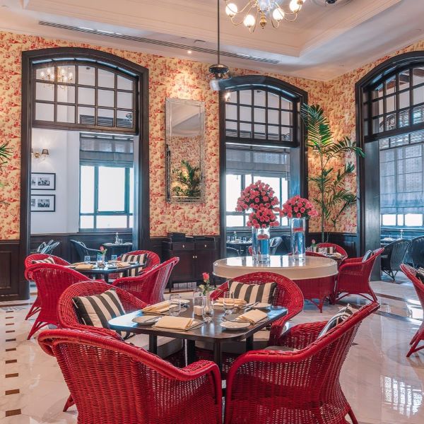 a room with red chairs and tables