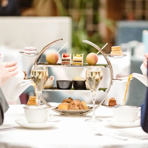 a group of people sitting at a table with food on it