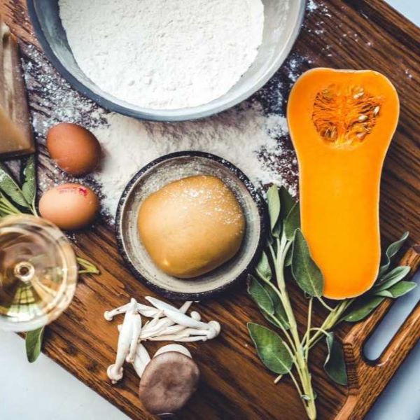 a wooden board with food ingredients on it