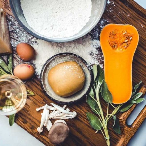 a wooden board with food ingredients on it