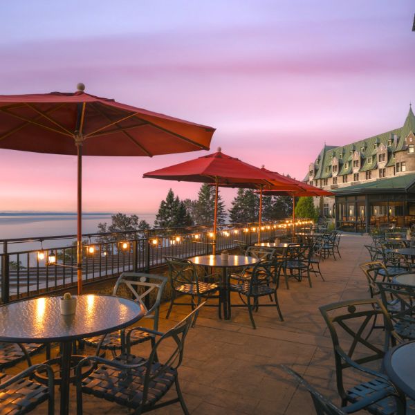 a patio with tables and umbrellas
