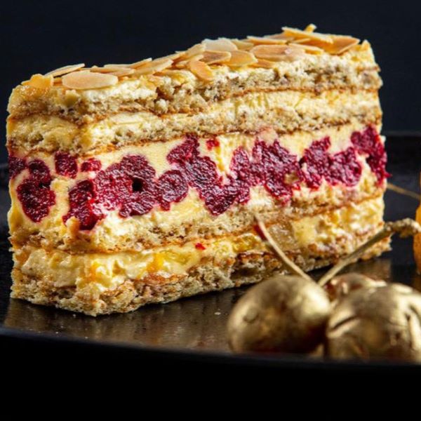 a piece of cake with almonds on top