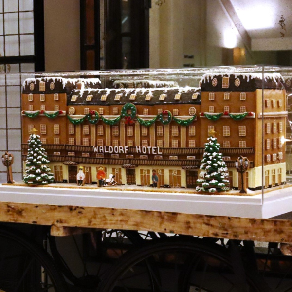 a model of a hotel in a glass case