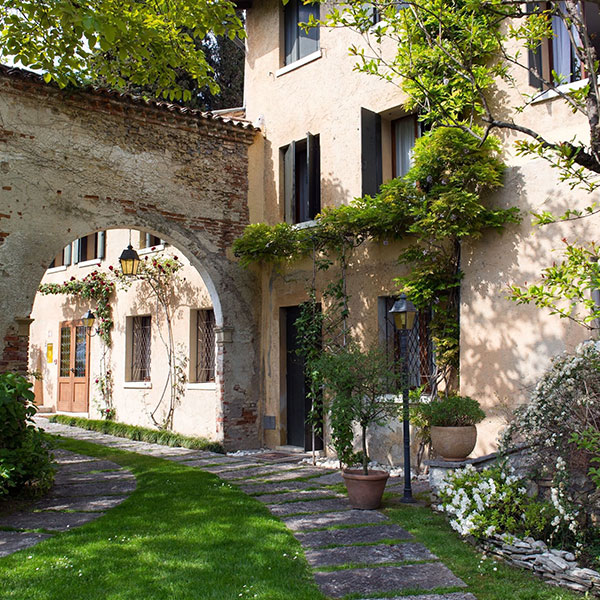 a stone walkway leading to a building