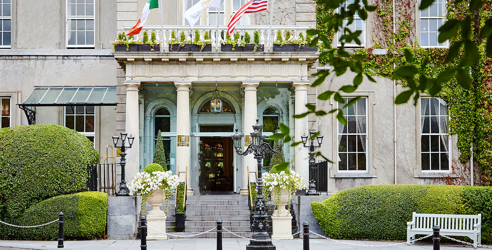 a building with columns and flags